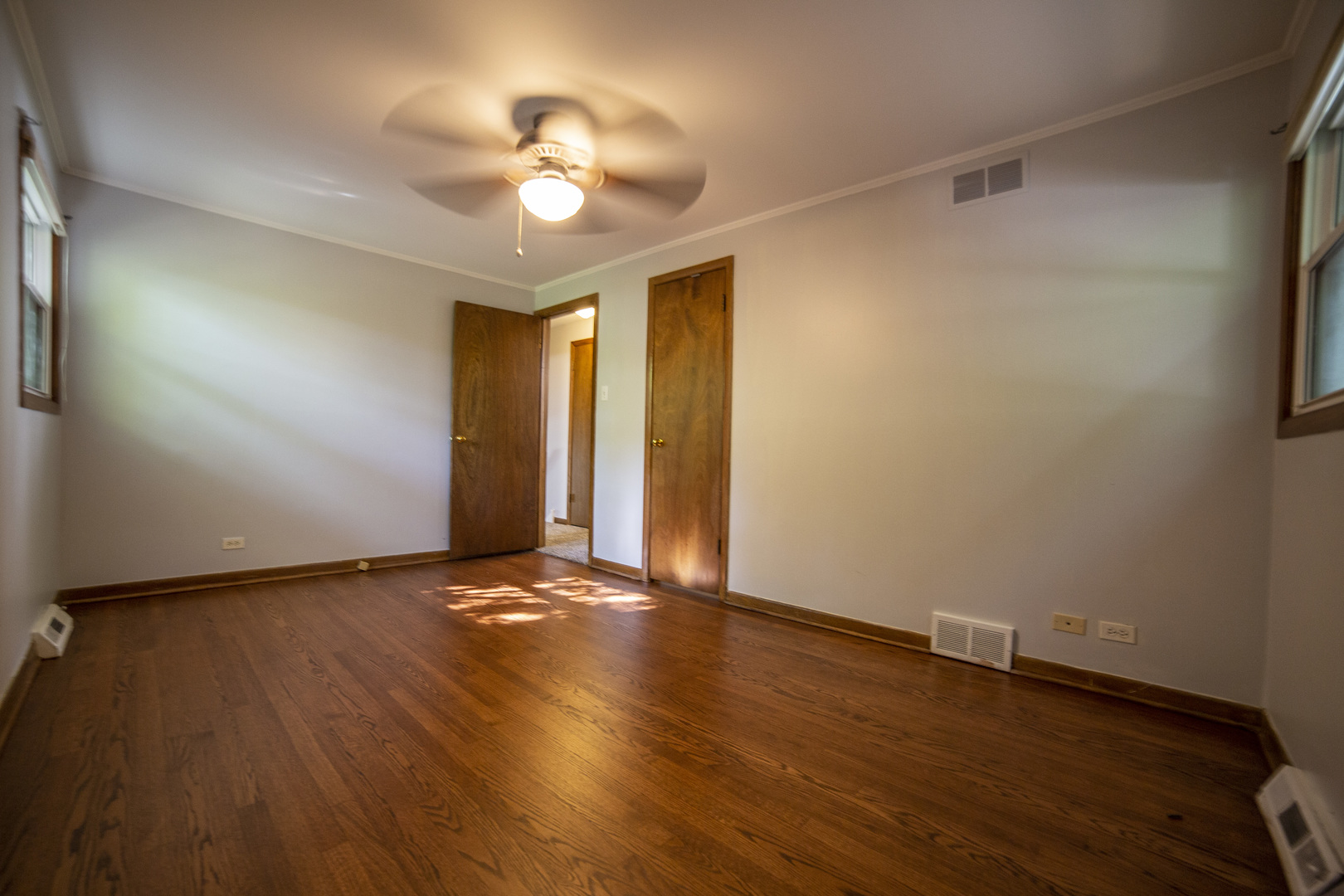 1222 Hickory Road Homewood, IL 60430 - Photo 13 of 29 an empty room with wooden floor and windows