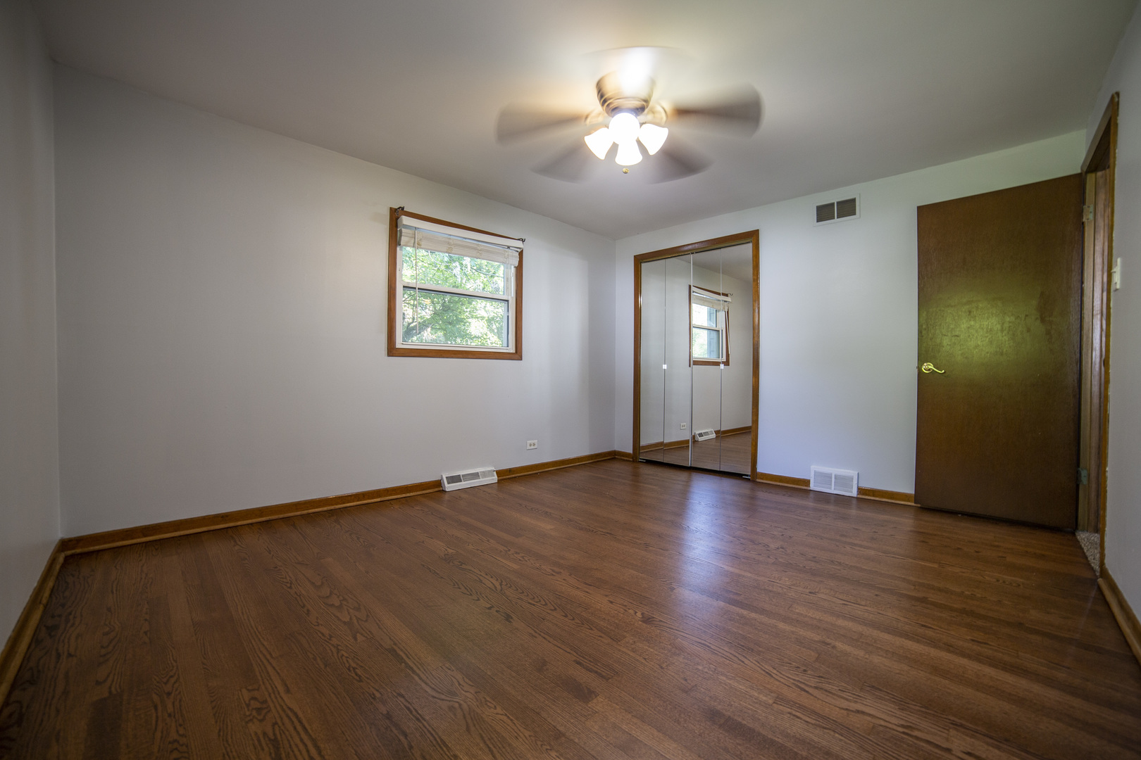 1222 Hickory Road Homewood, IL 60430 - Photo 14 of 29 wooden floor in an empty room with a window