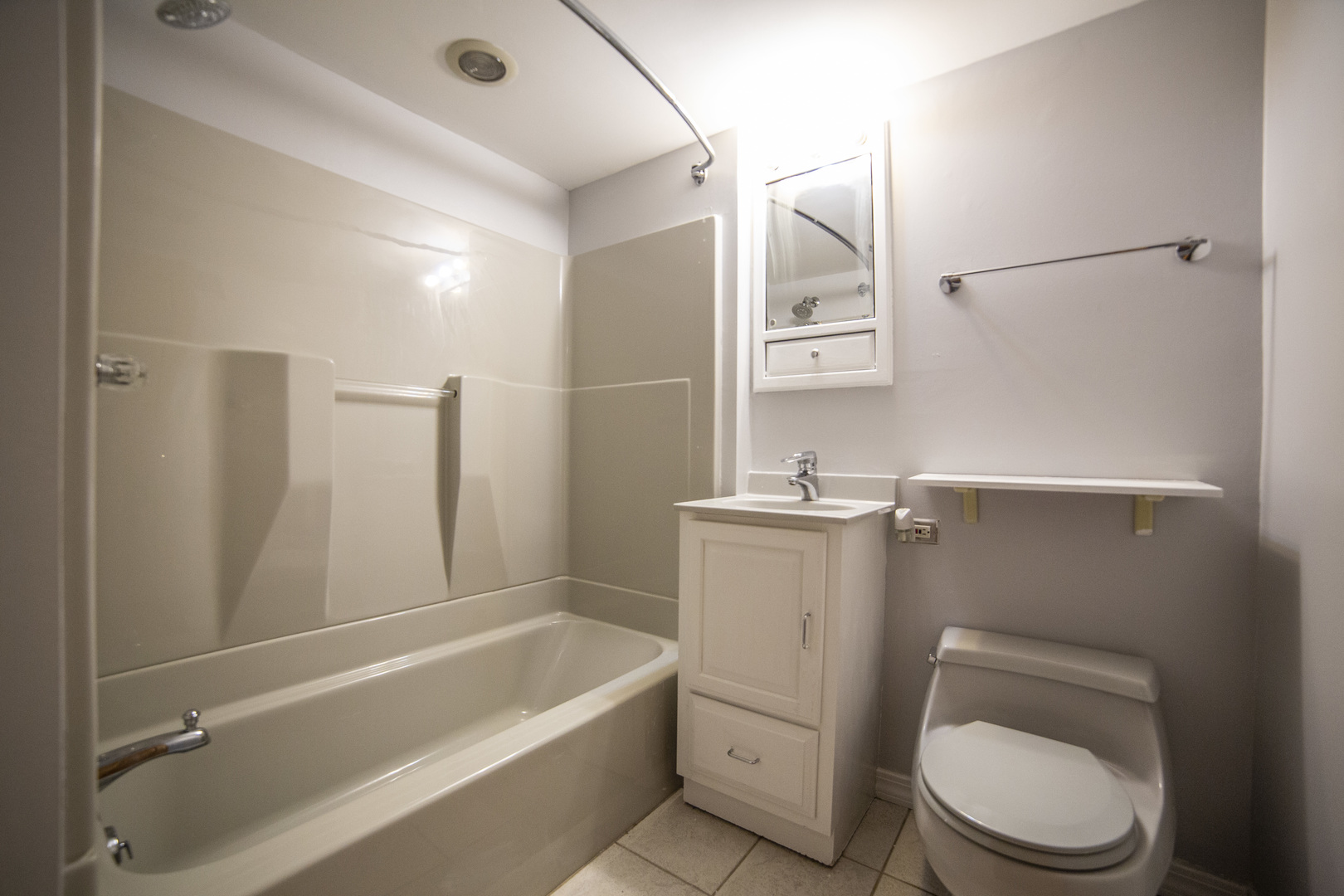 1222 Hickory Road Homewood, IL 60430 - Photo 22 of 29 a bathroom with a sink a toilet and shower