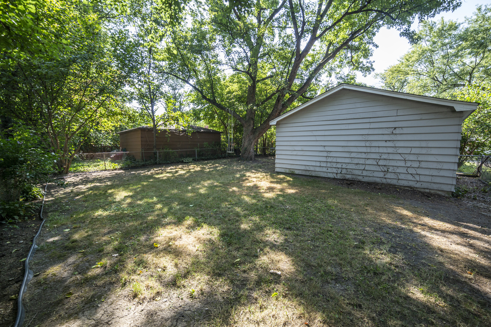 1222 Hickory Road Homewood, IL 60430 - Photo 27 of 29 a backyard of a house with lots of green space