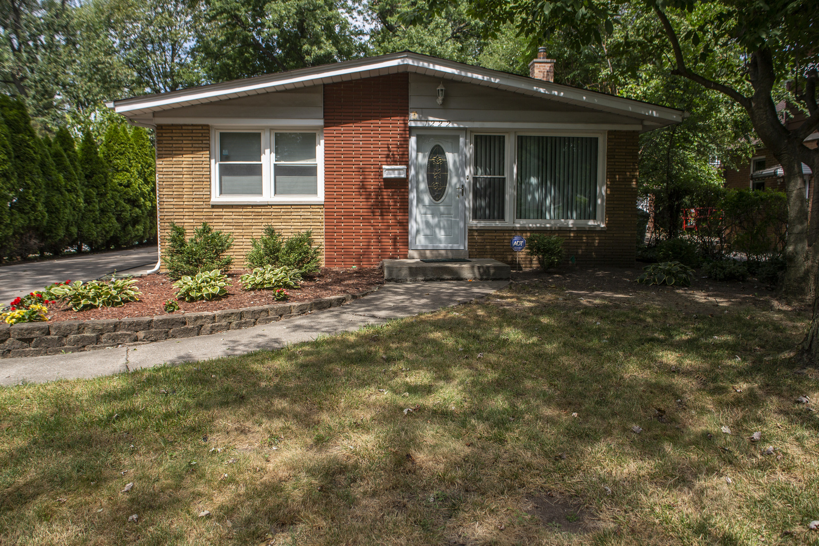 1222 Hickory Road Homewood, IL 60430 - Photo 29 of 29 a front view of a house with a yard