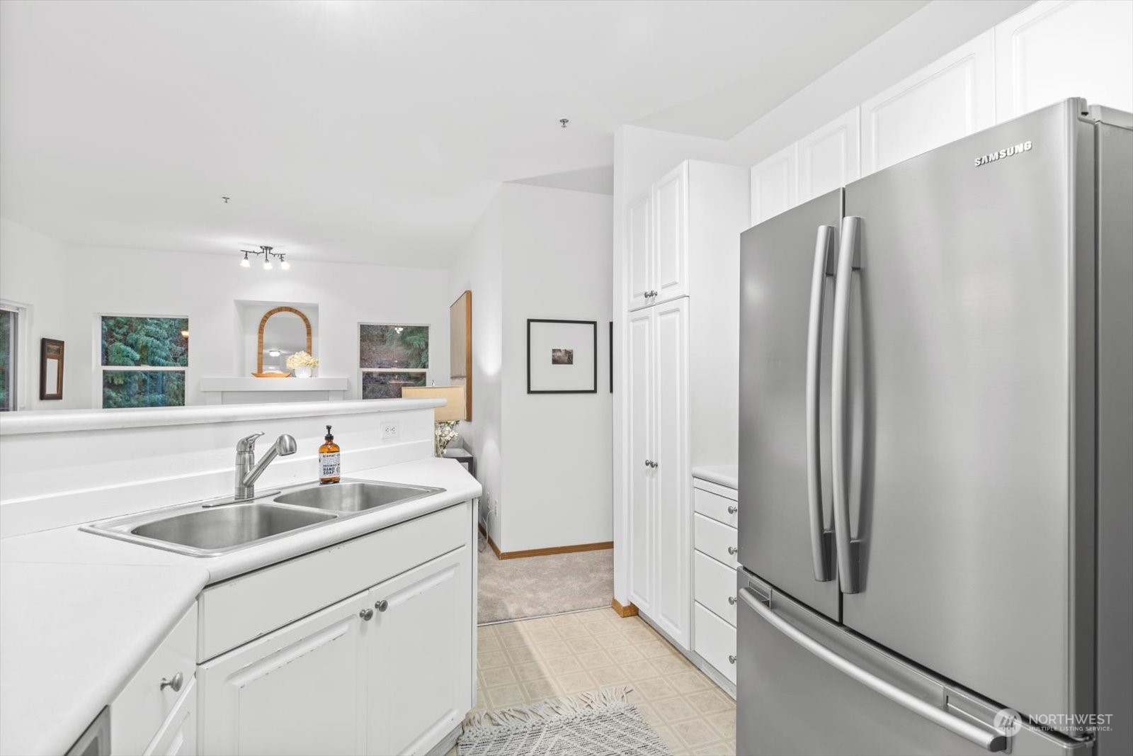 17757 134th Lane Southeast Renton, WA 98058 - Photo 16 of 38 a kitchen with stainless steel appliances granite countertop a refrigerator and a sink
