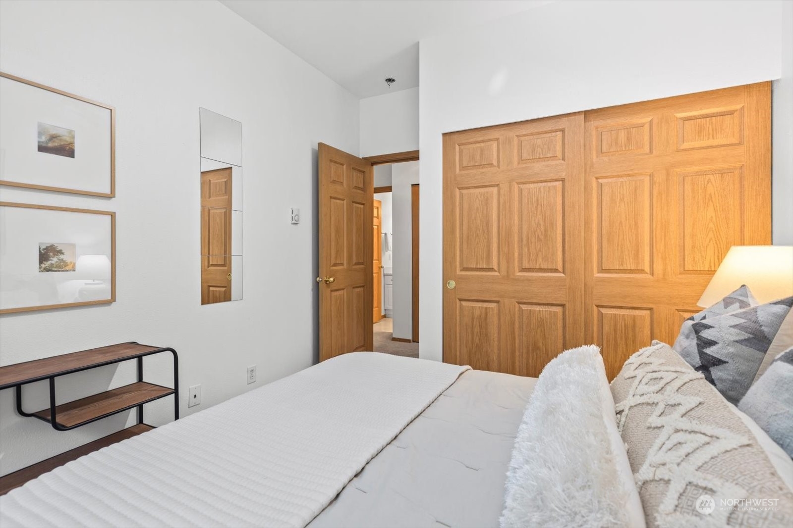 17757 134th Lane Southeast Renton, WA 98058 - Photo 30 of 38 a bedroom with a bed a dresser with wooden floor