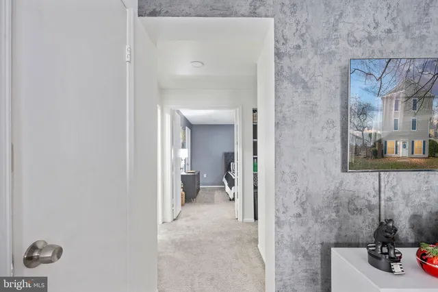 a view of a bathroom from a hallway
