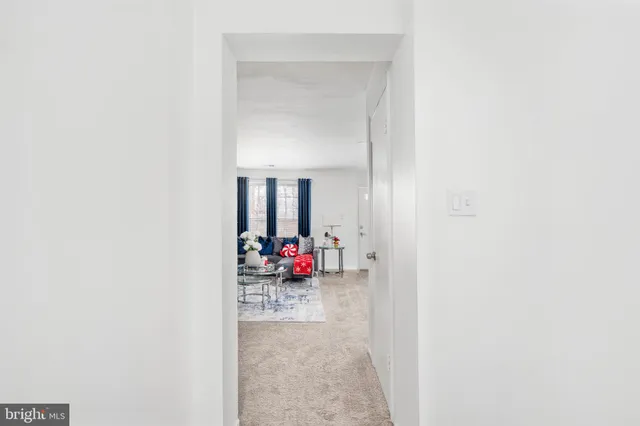 a view of a room with workspace and a mirror