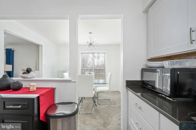 a kitchen with a stove and a microwave