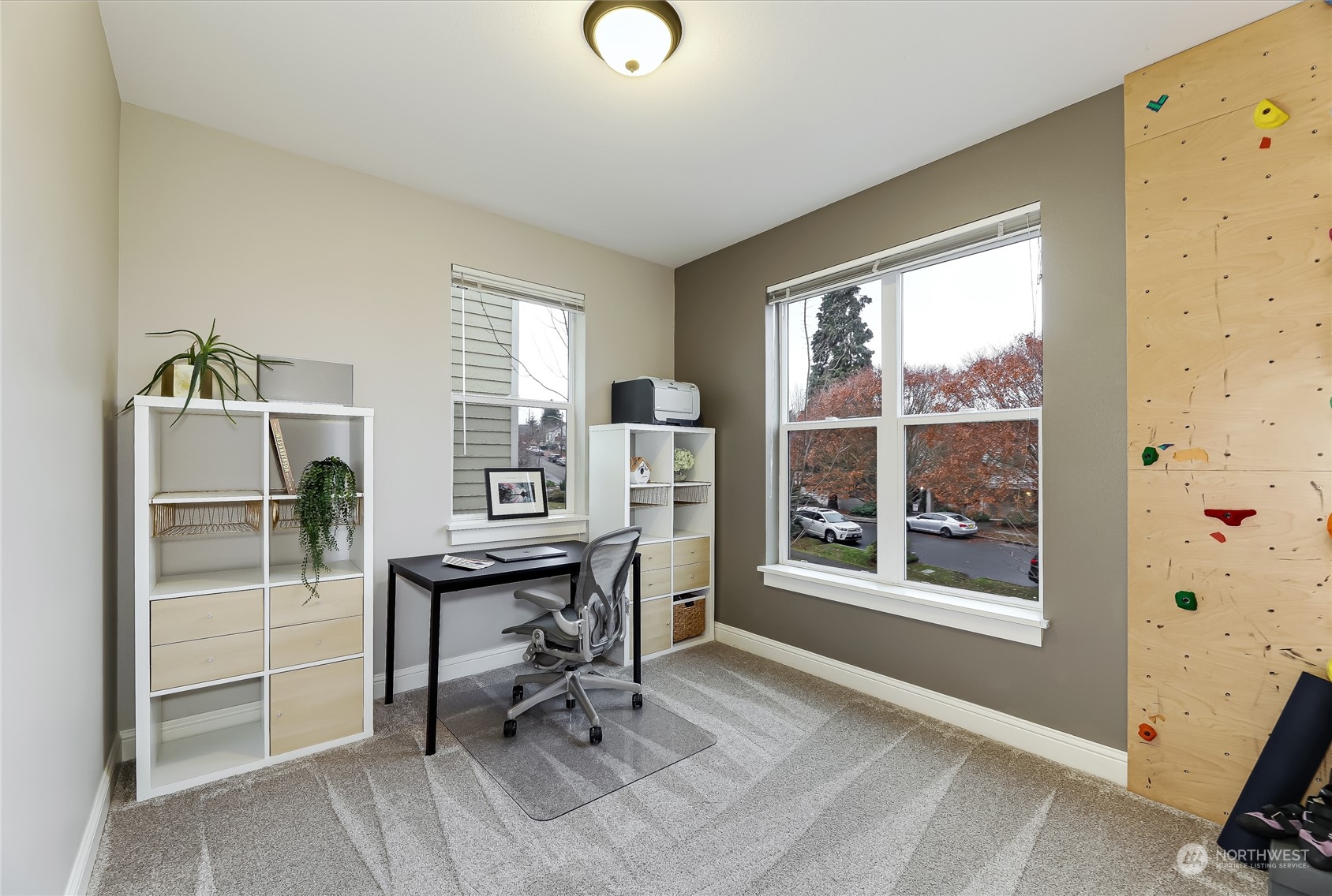 3117 Southwest Raymond Street Seattle, WA 98126 - Photo 17 of 36 a view of a workspace with furniture and a window