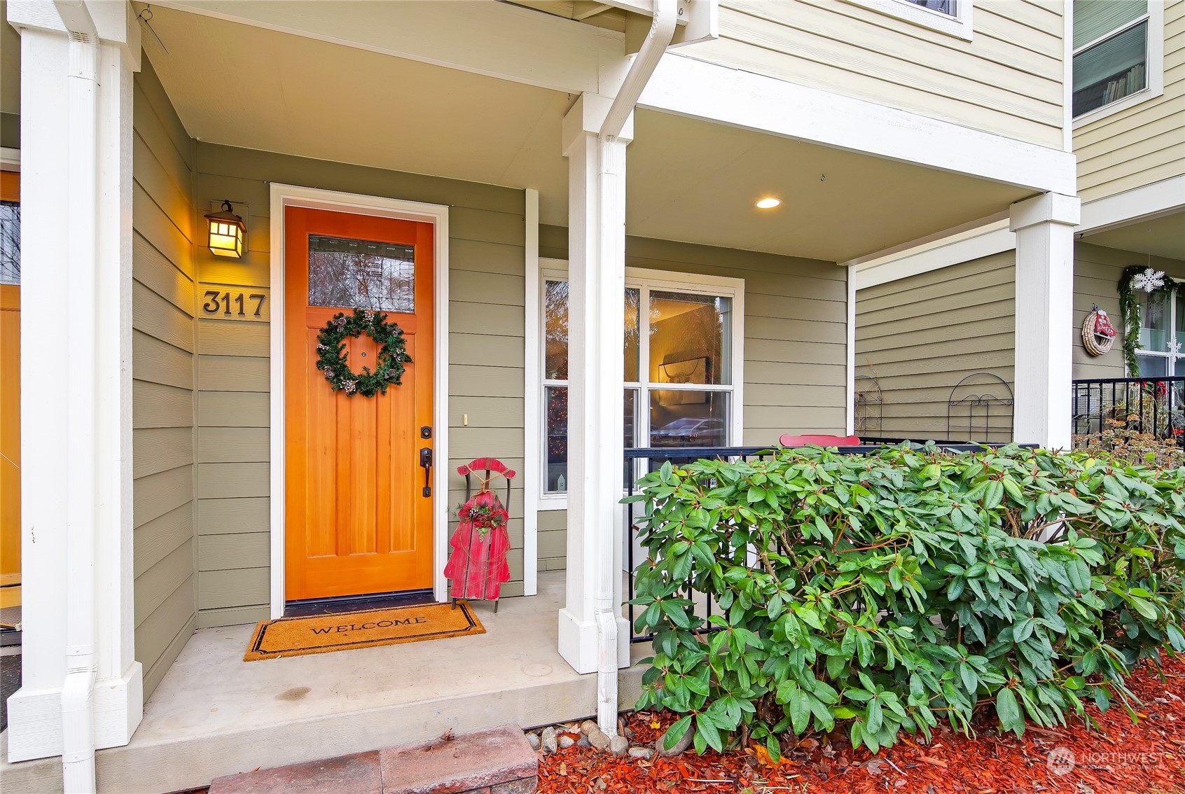 3117 Southwest Raymond Street Seattle, WA 98126 - Photo 2 of 36 a front view of a house with a yard