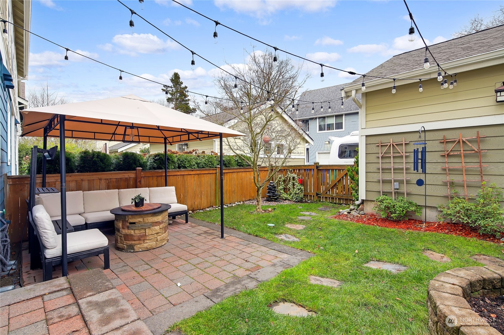 3117 Southwest Raymond Street Seattle, WA 98126 - Photo 33 of 36 a view of a patio with table and chairs potted plants