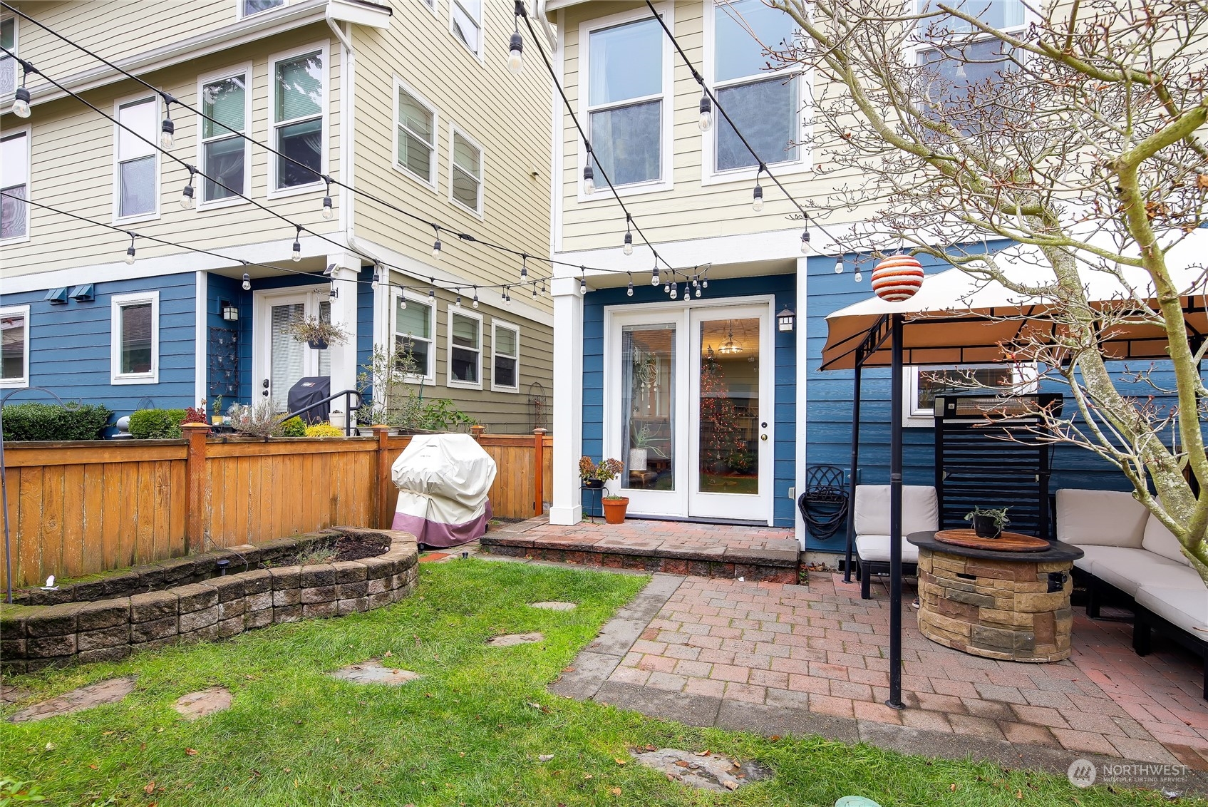 3117 Southwest Raymond Street Seattle, WA 98126 - Photo 34 of 36 a view of a patio with a table and chairs and potted plants