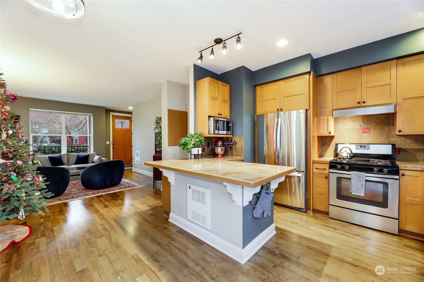 3117 Southwest Raymond Street Seattle, WA 98126 - Photo 6 of 36 a kitchen with stainless steel appliances granite countertop a stove and a large window