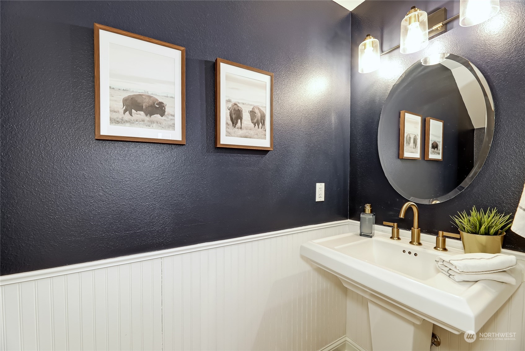 3117 Southwest Raymond Street Seattle, WA 98126 - Photo 10 of 36 a bathroom with a double vanity sink and a mirror
