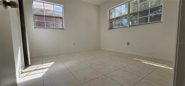 a view of an empty room with a window