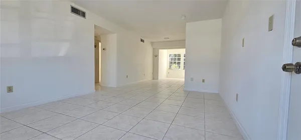a view of an empty room and window