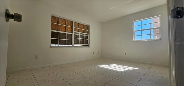 a view of empty room with windows