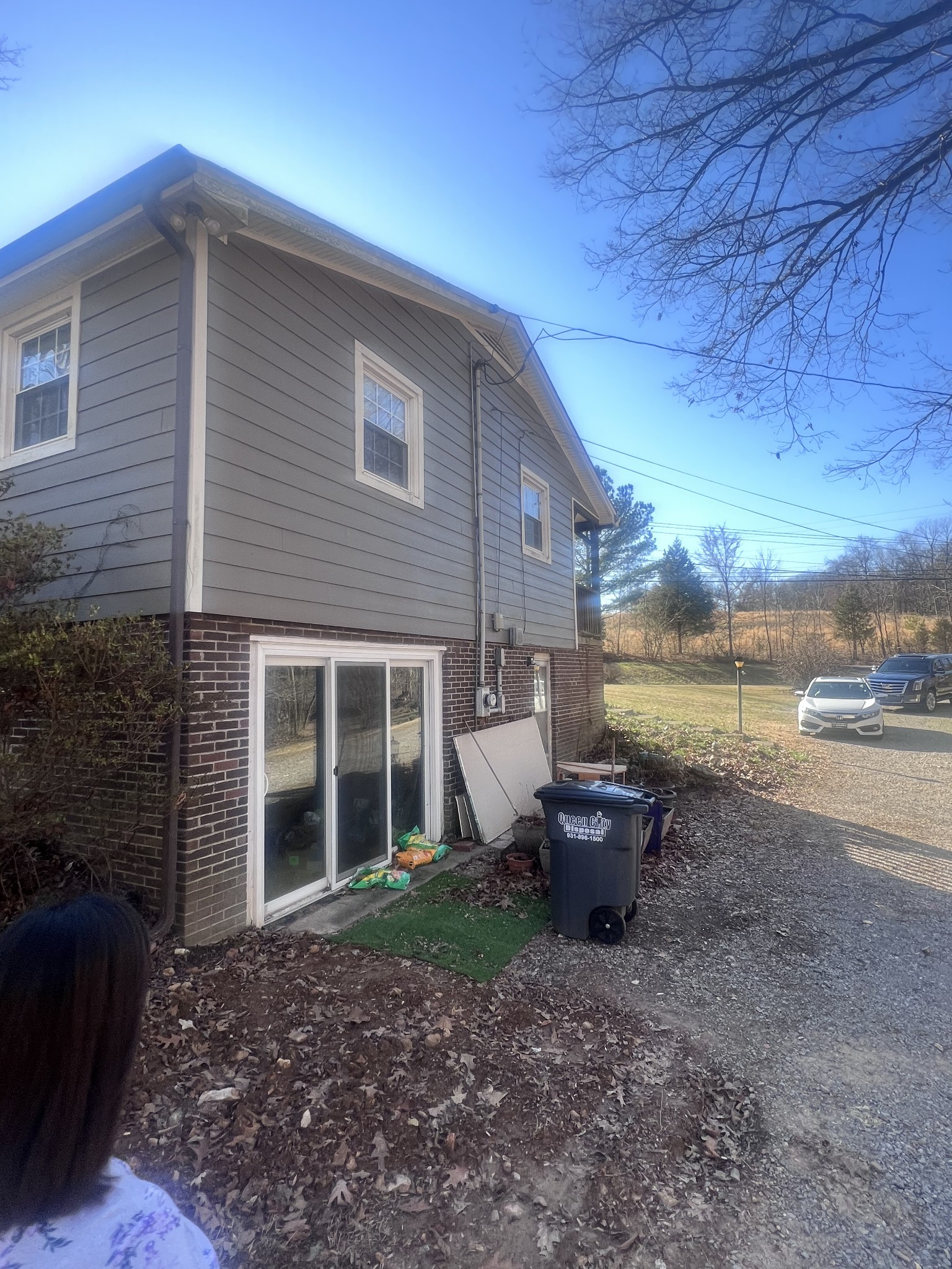 2189 Whitfield Road Clarksville, TN 37040 - Photo 3 of 24 a view of a backyard with plants and a lake view