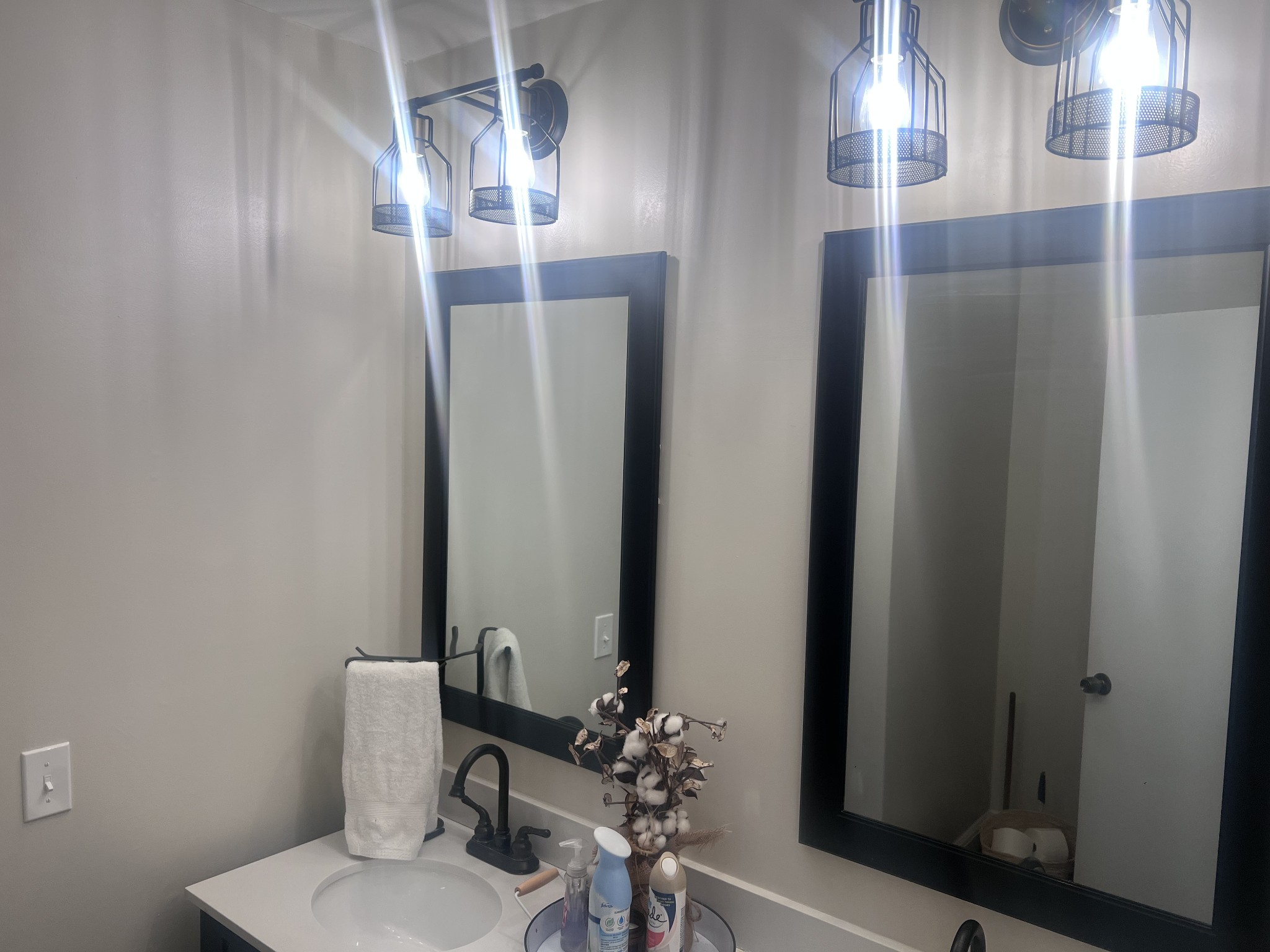 2189 Whitfield Road Clarksville, TN 37040 - Photo 9 of 24 a bathroom with a light fixture and a mirror