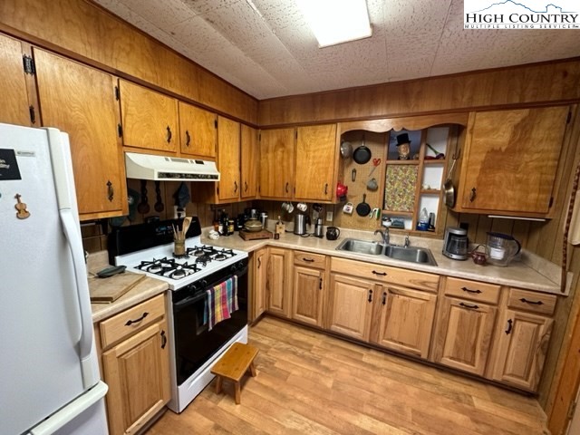 495 Rocky Top Lane Independence, VA 24348 - Photo 26 of 39 a kitchen with stainless steel appliances granite countertop a stove a sink and a refrigerator