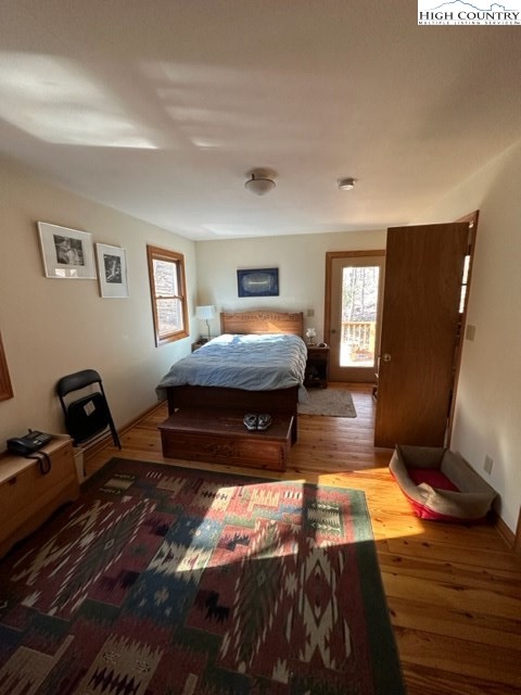 495 Rocky Top Lane Independence, VA 24348 - Photo 29 of 39 a bedroom with a bed and wooden floor