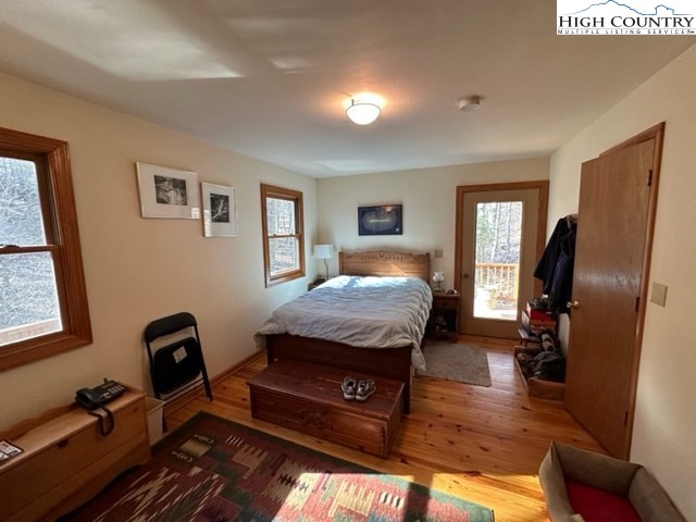 495 Rocky Top Lane Independence, VA 24348 - Photo 33 of 39 a bedroom with a bed wooden floor and window