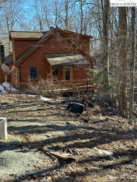 495 Rocky Top Lane Independence, VA 24348 - Photo 39 of 39 a backyard of a house with a large tree