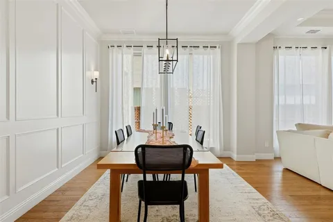 a view of a room with a table and chairs
