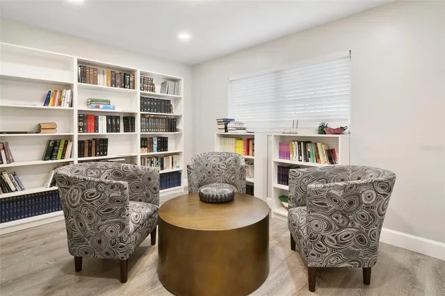 a bathroom with a sink a light fixture and a mirror