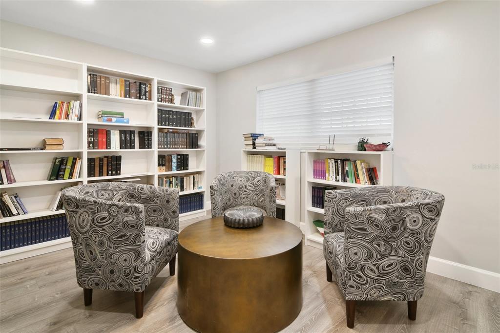 5150 Old Howell Branch Road Winter Park, FL 32792 - Photo 11 of 17 a living room with furniture and a book shelf