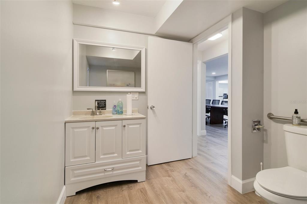 5150 Old Howell Branch Road Winter Park, FL 32792 - Photo 13 of 17 a bathroom with a sink toilet vanity and mirror