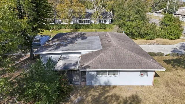 a view of a tree with a yard