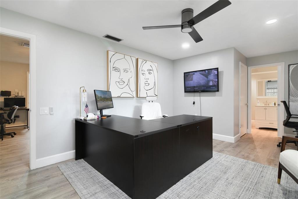 5150 Old Howell Branch Road Winter Park, FL 32792 - Photo 7 of 17 a living room with furniture and a flat screen tv