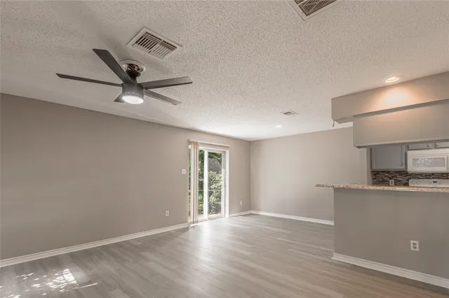 a view of a kitchen with a sink and a window