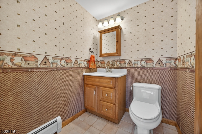 61 Coykendall Road Wantage, NJ 07461 - Photo 18 of 43 a bathroom with a toilet a sink and a mirror