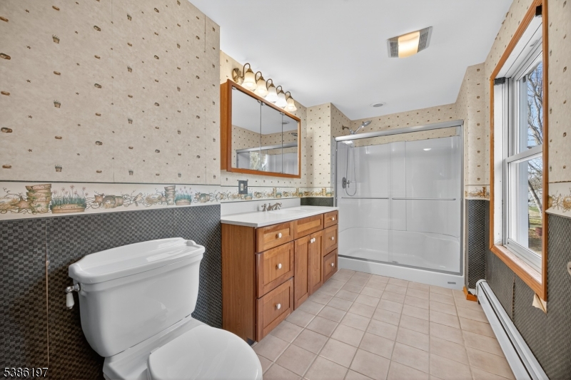 61 Coykendall Road Wantage, NJ 07461 - Photo 20 of 43 a bathroom with a granite countertop sink toilet and shower