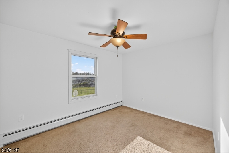 61 Coykendall Road Wantage, NJ 07461 - Photo 23 of 43 a view of an empty room with a window