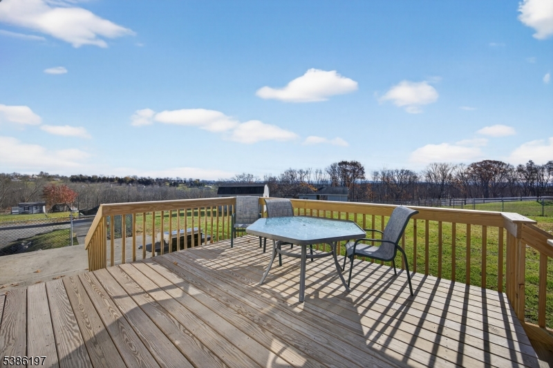 61 Coykendall Road Wantage, NJ 07461 - Photo 28 of 43 a view of a balcony with wooden floor and city view