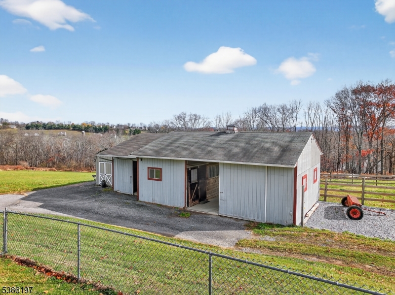 61 Coykendall Road Wantage, NJ 07461 - Photo 30 of 43 a view of a house with a backyard and a lake view