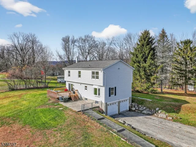 a view of a house with backyard porch and garden