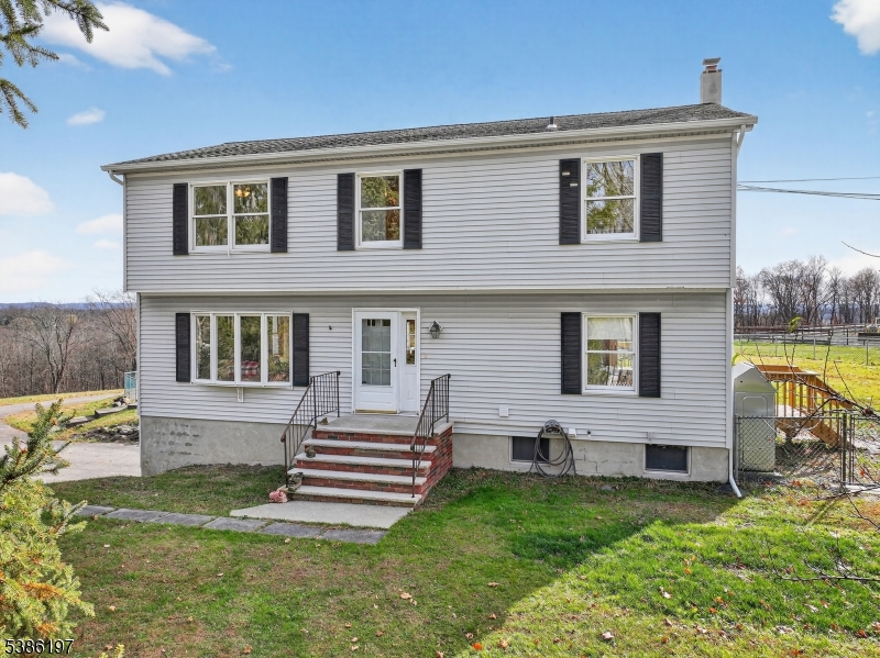 61 Coykendall Road Wantage, NJ 07461 - Photo 38 of 43 a house view with a garden space