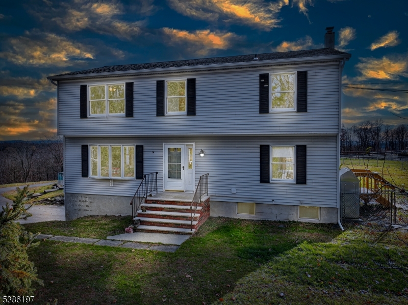 61 Coykendall Road Wantage, NJ 07461 - Photo 41 of 43 a front view of a house with garden