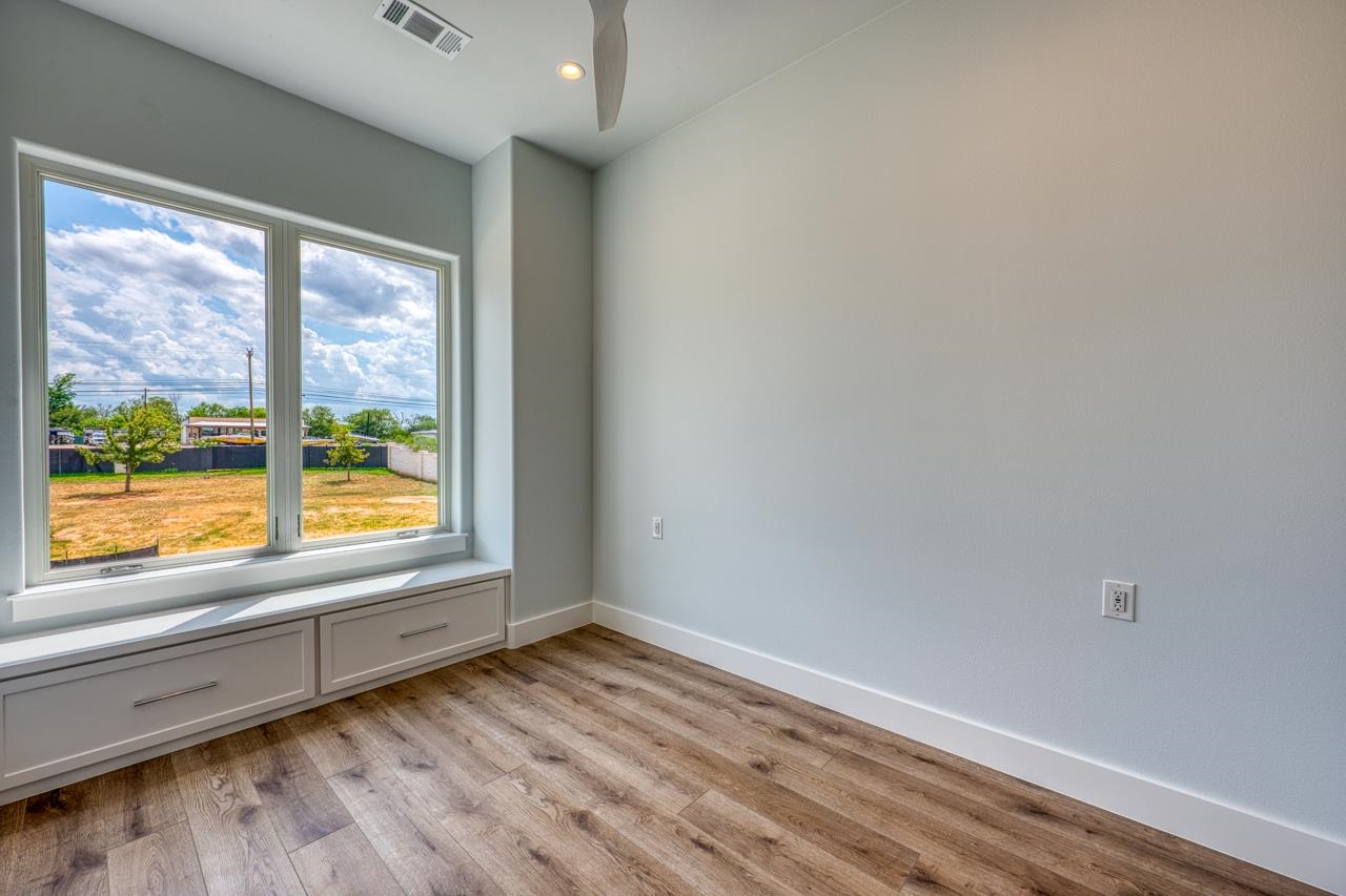 320 Lake Street Kingsland, TX 78639 - Photo 19 of 30 an empty room with wooden floor and a window