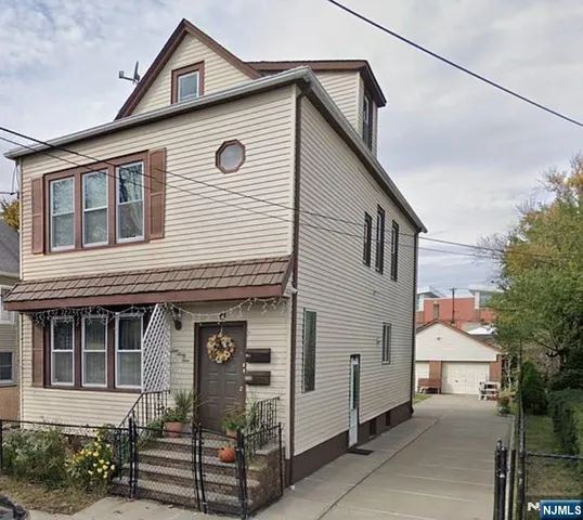 a front view of a house with a garage