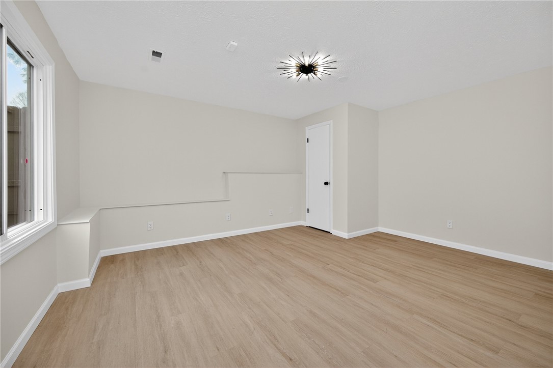 811 Wind Bluff Point Springboro, OH 45066 - Photo 37 of 51 This spacious room offers versatile living with ample natural light and modern flooring.