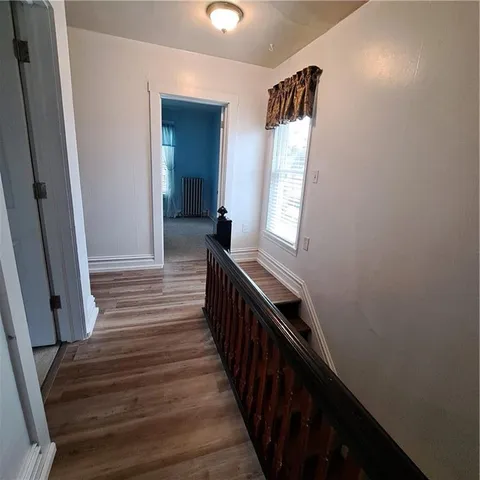 a view of a storage and utility room with a sink