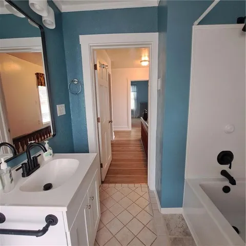 a bathroom with a bathtub and a shower