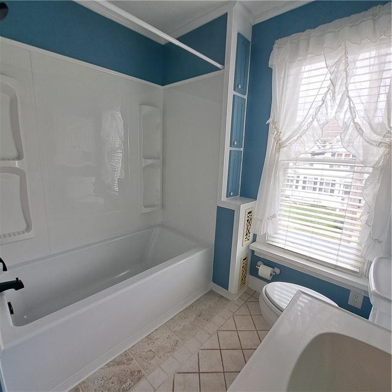439 Longfellow Street Vandergrift, PA 15690 - Photo 19 of 49 a bathroom with a bathtub and a shower