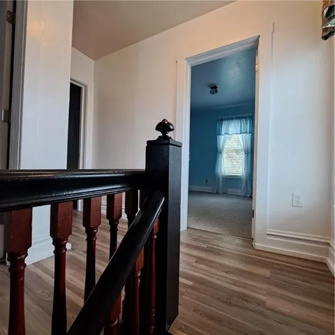 a view of entryway with wooden floor