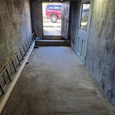 a view of a hallway with stairs
