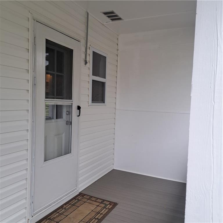 439 Longfellow Street Vandergrift, PA 15690 - Photo 40 of 49 a view of an empty room with wooden floor and a window
