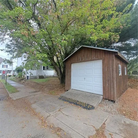 a house with a tree in front of it